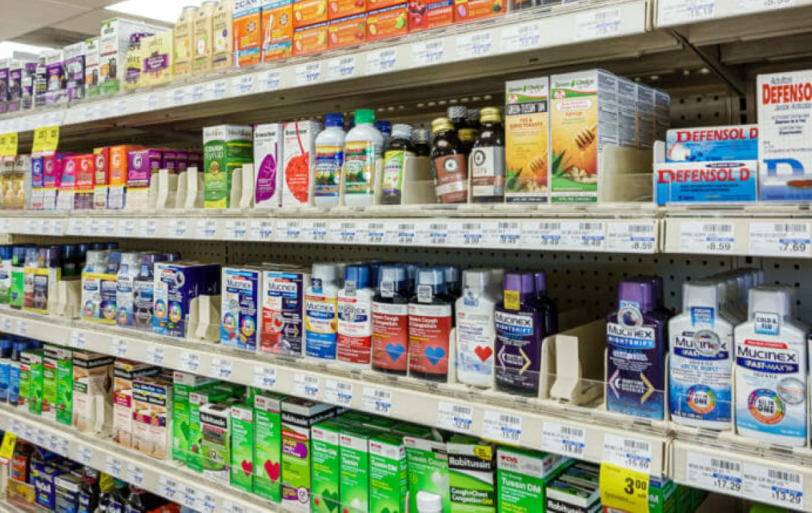 a photo image of a display rack of medicine in a pharmary